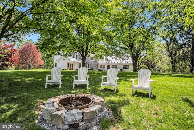 view of yard with a fire pit