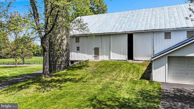 exterior space featuring fence and a garage