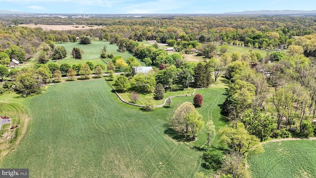 birds eye view of property with a view of trees
