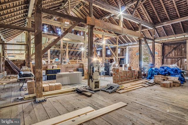 misc room featuring lofted ceiling and hardwood / wood-style floors
