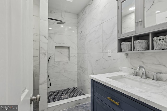 6227 Delancey St, Philadelphia, PA 19143 - full bath with a marble finish shower, vanity, and tile walls