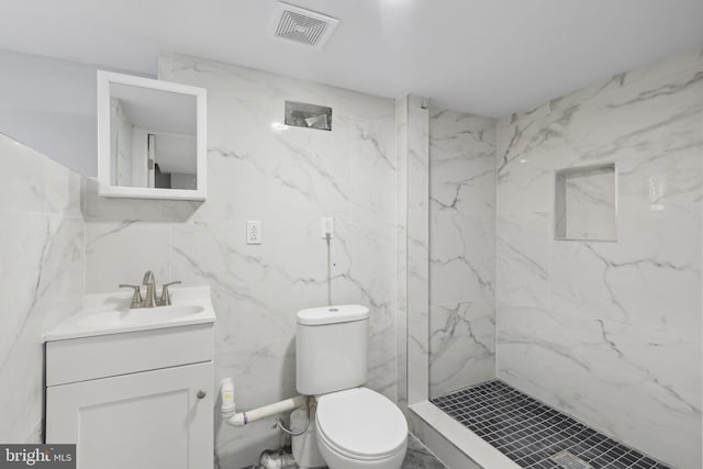 6227 Delancey St, Philadelphia, PA 19143 - bathroom with visible vents, a marble finish shower, toilet, and tile walls