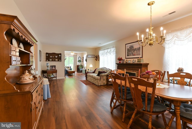 102 Lakebridge Dr, Deptford, NJ 08096 - dining area featuring an inviting chandelier, dark wood-style flooring, and visible vents