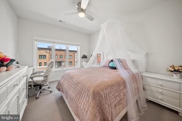 carpeted bedroom featuring ceiling fan and visible vents