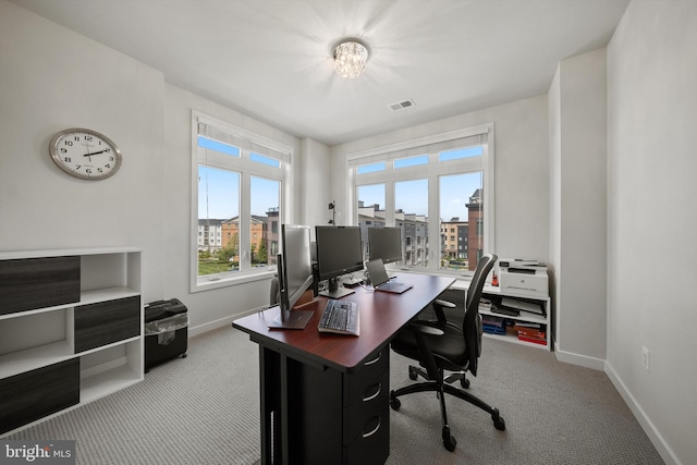 office with baseboards, carpet, and visible vents