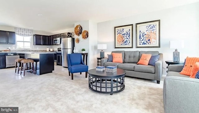 living area featuring light colored carpet