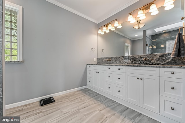 bathroom with double vanity, baseboards, a shower stall, visible vents, and ornamental molding
