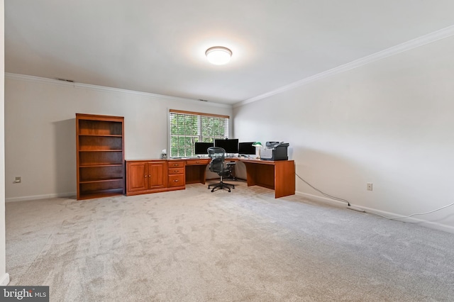 home office featuring baseboards, light colored carpet, and ornamental molding