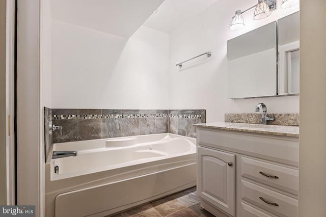 full bath with vanity and a garden tub
