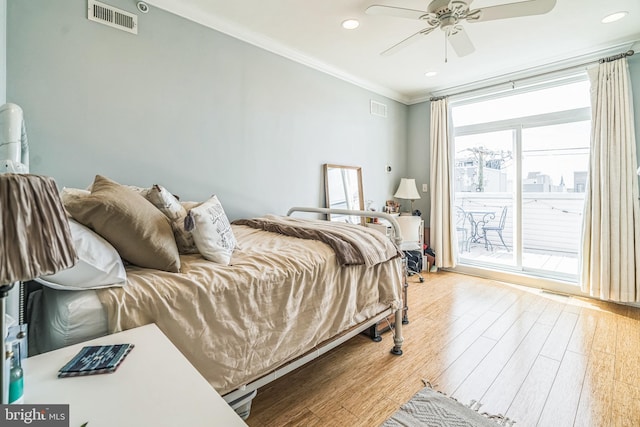 bedroom with access to outside, visible vents, ornamental molding, and light wood-style floors