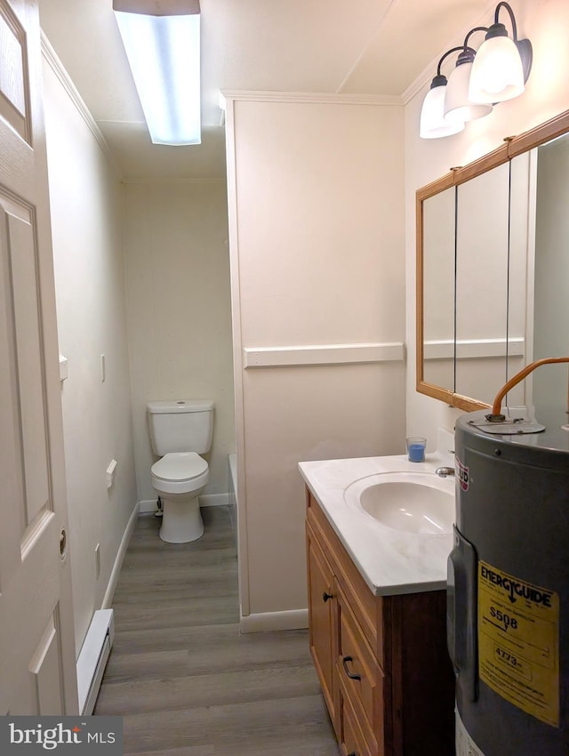405 Poplar St, Salisbury, MD 21804 - full bathroom featuring a baseboard radiator, toilet, vanity, wood finished floors, and water heater