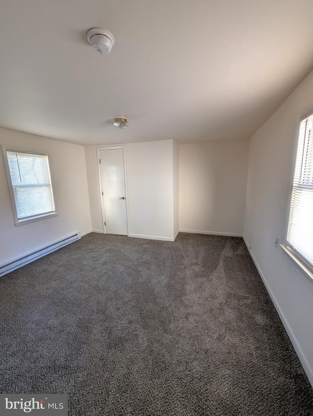 405 Poplar St, Salisbury, MD 21804 - empty room with dark colored carpet, baseboards, and baseboard heating