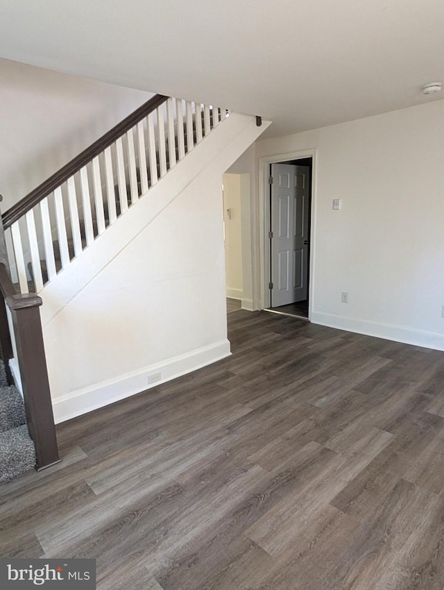 405 Poplar St, Salisbury, MD 21804 - unfurnished living room with baseboards, stairway, and dark wood-style floors