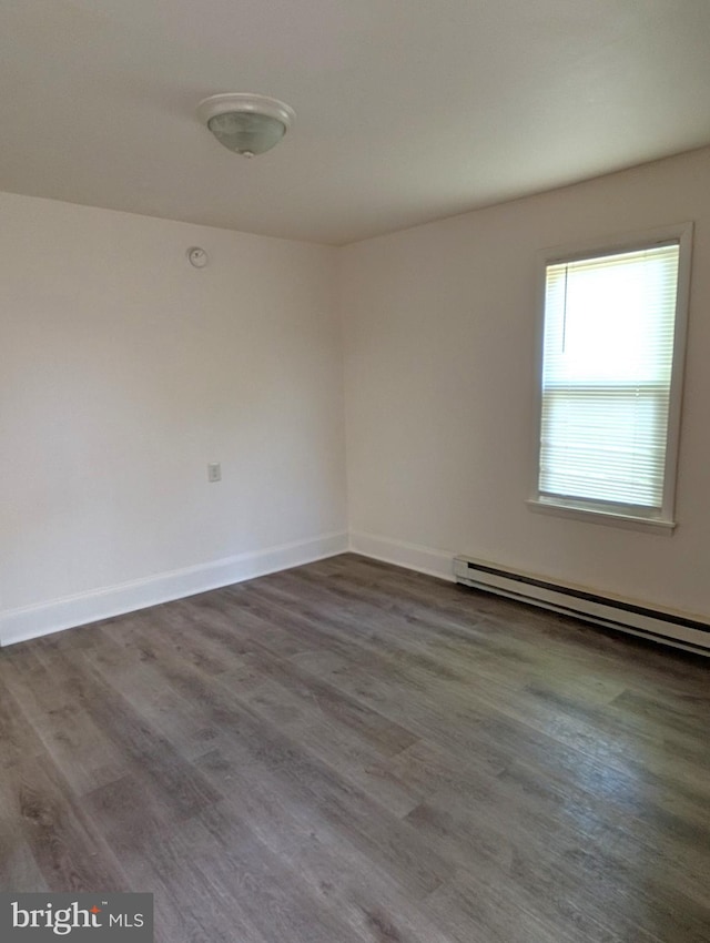 405 Poplar St, Salisbury, MD 21804 - unfurnished room featuring baseboards, baseboard heating, and wood finished floors
