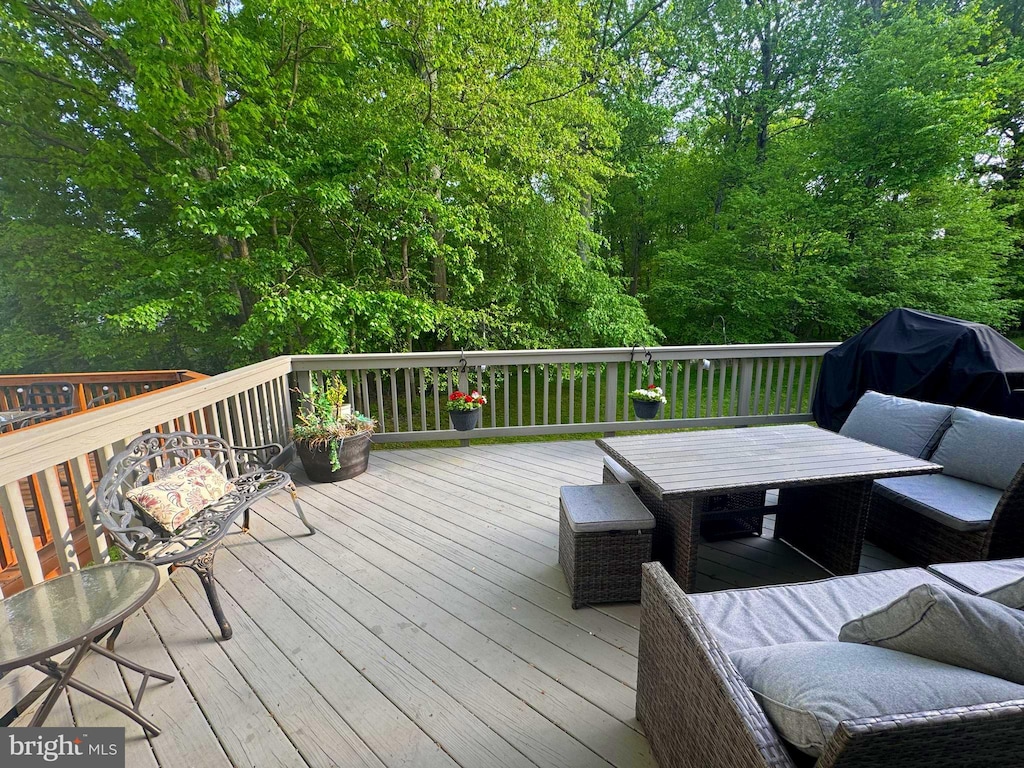 wooden terrace with outdoor dining area