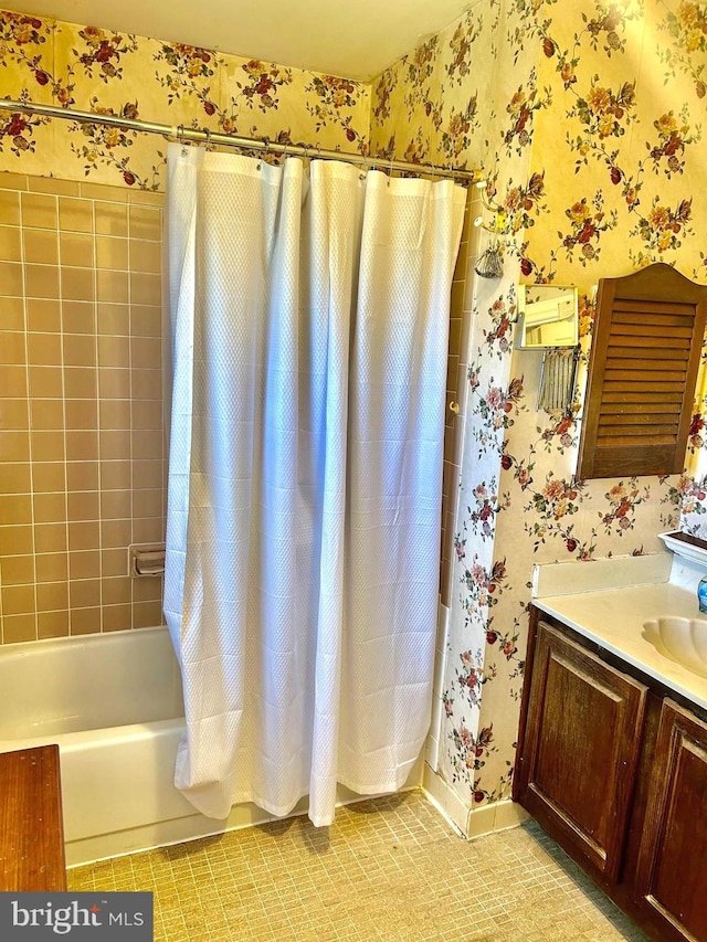 6908 Baltimore Ave, Hyattsville, MD 20782 - bathroom with wallpapered walls, shower / tub combo, vanity, and tile patterned flooring