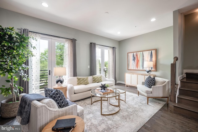 living area featuring recessed lighting, baseboards, stairs, and wood finished floors
