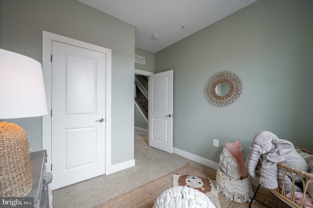 sitting room featuring baseboards, carpet flooring, and visible vents