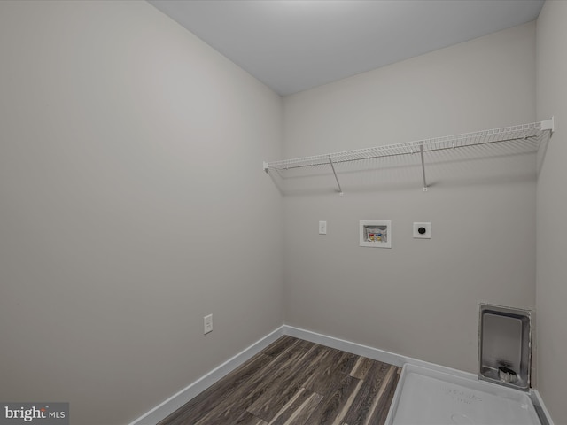 laundry room with laundry area, hookup for a washing machine, dark wood finished floors, electric dryer hookup, and baseboards
