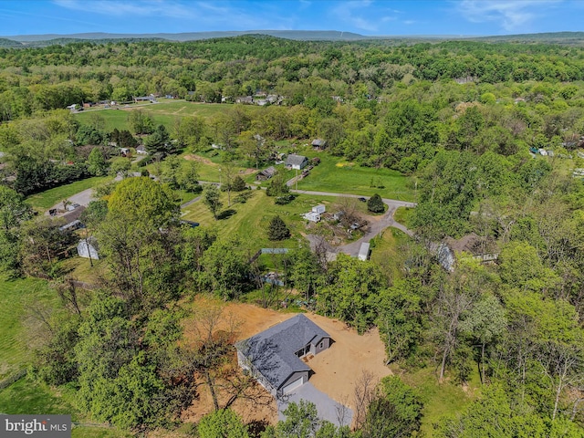 bird's eye view featuring a forest view