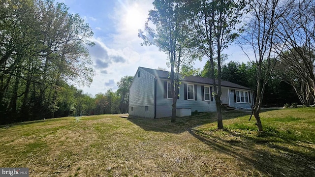 view of home's exterior featuring a yard and crawl space