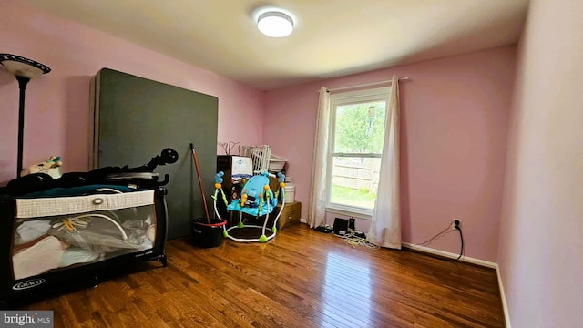 bedroom with wood finished floors