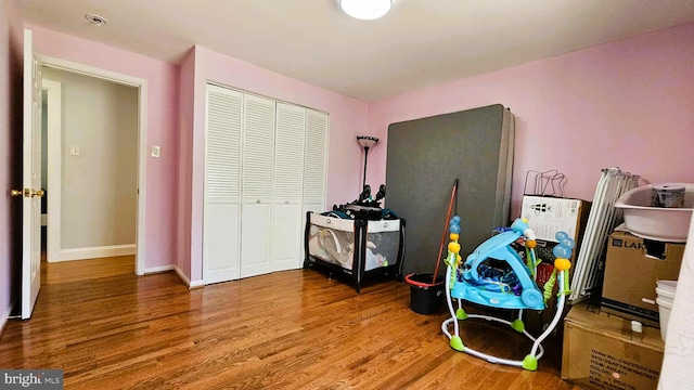 interior space featuring baseboards and wood finished floors