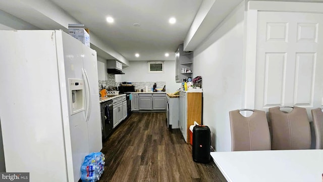 kitchen with decorative backsplash, dark wood-style floors, white fridge with ice dispenser, light countertops, and gray cabinetry
