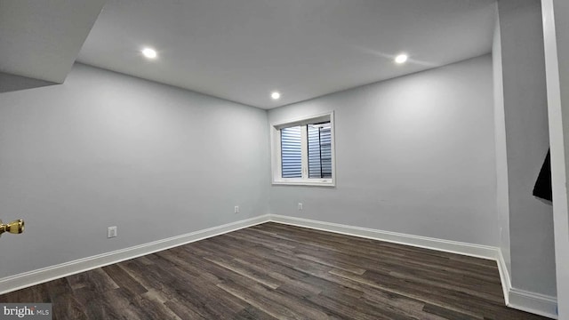 unfurnished room featuring baseboards, recessed lighting, and dark wood-style flooring
