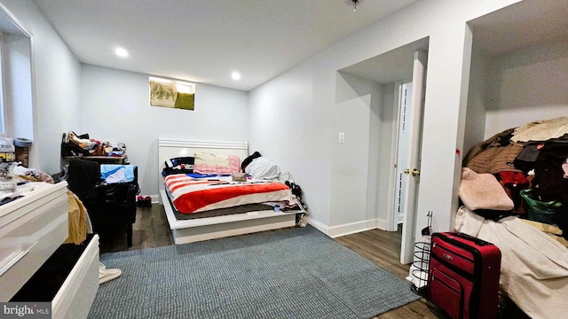 bedroom featuring recessed lighting, baseboards, and wood finished floors