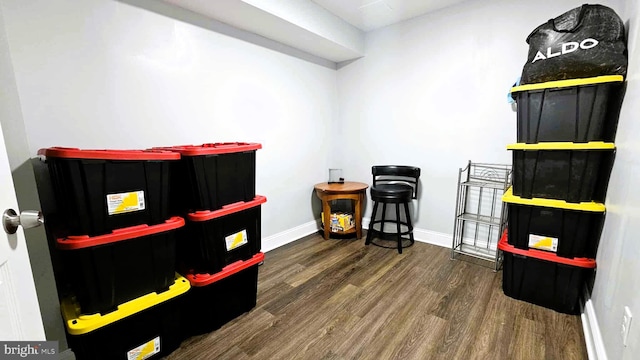 game room featuring baseboards and wood finished floors
