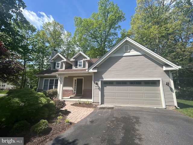 11801 Pond Crest Ct, New Market, MD 21774 - view of front of home featuring asphalt driveway, an attached garage, and a chimney
