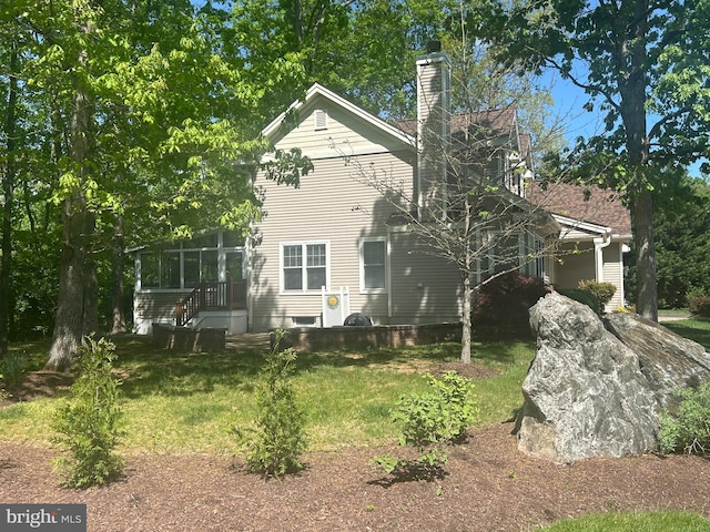 11801 Pond Crest Ct, New Market, MD 21774 - back of house with a chimney and a lawn