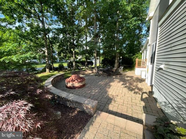11801 Pond Crest Ct, New Market, MD 21774 - view of patio / terrace featuring an outdoor fire pit
