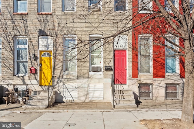 entrance to property with stone siding