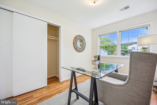 dining room with wood finished floors and baseboards