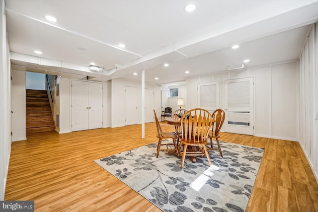 dining area featuring light wood-style floors, stairway, recessed lighting, and baseboards