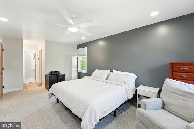 bedroom with baseboards, ceiling fan, recessed lighting, and light colored carpet