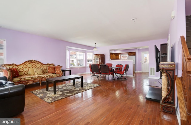 1129 Mediterranean Ave, Atlantic City, NJ 08401 - living area featuring baseboards, visible vents, and wood finished floors