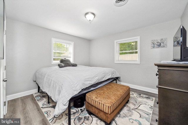 2304 Milltown Rd, Wilmington, DE 19808 - bedroom with baseboards, wood finished floors, and visible vents