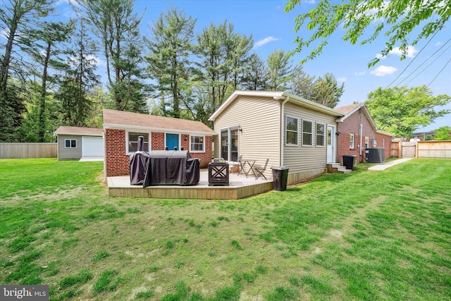 2304 Milltown Rd, Wilmington, DE 19808 - rear view of property with a fenced backyard, central AC, and a yard