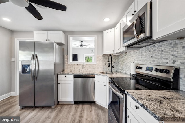 2304 Milltown Rd, Wilmington, DE 19808 - kitchen featuring ceiling fan, appliances with stainless steel finishes, a sink, white cabinets, and light wood-style floors