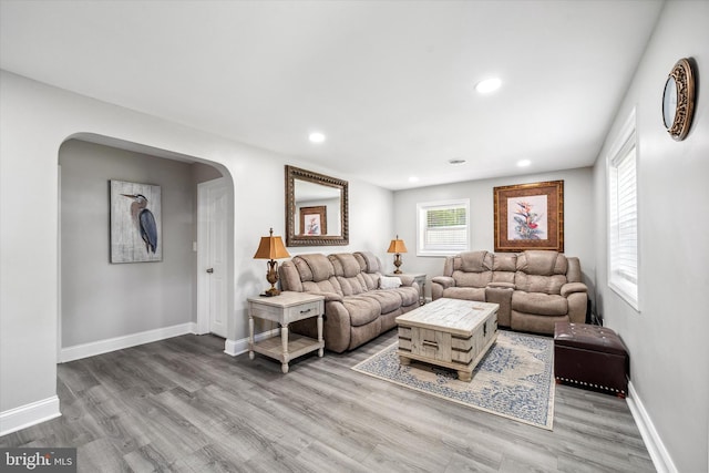 2304 Milltown Rd, Wilmington, DE 19808 - living area featuring baseboards, arched walkways, wood finished floors, and recessed lighting