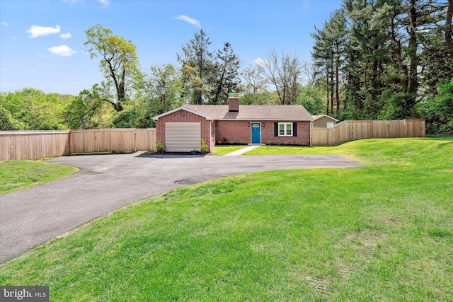 2304 Milltown Rd, Wilmington, DE 19808 - view of front facade with fence, a chimney, aphalt driveway, and brick siding