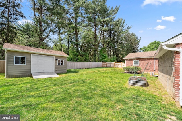 2304 Milltown Rd, Wilmington, DE 19808 - view of yard with a detached garage, an outbuilding, and a fenced backyard