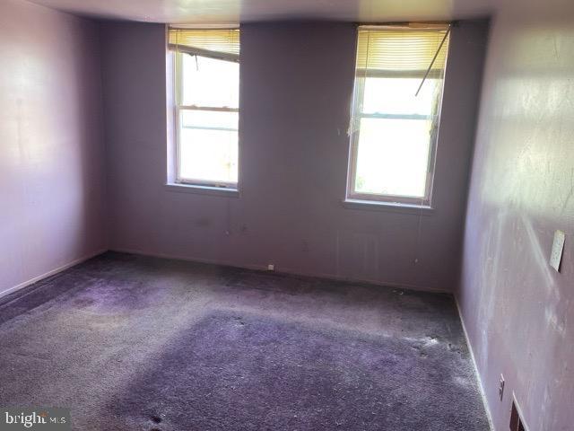 empty room with carpet flooring