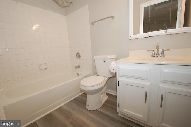 bathroom featuring vanity, shower / bath combination, wood finished floors, and toilet