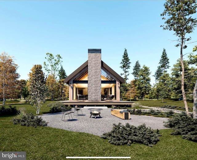 back of property with a yard and a chimney