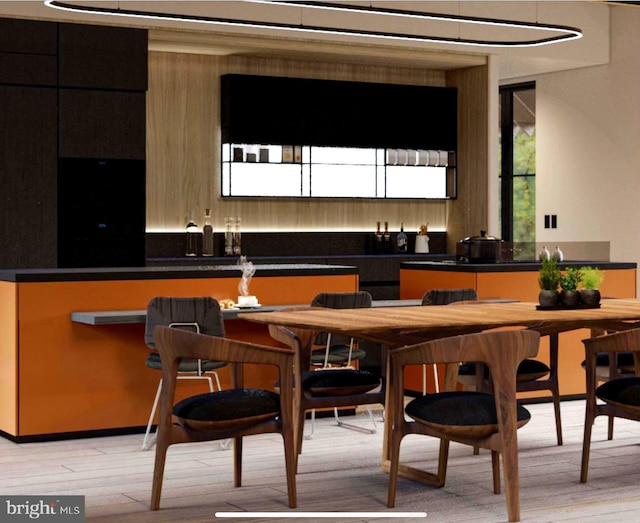bar featuring light wood-type flooring
