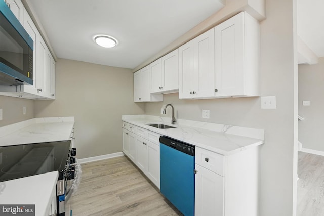 kitchen with stainless steel electric range oven, dishwasher, a sink, light stone counters, and light wood-style flooring